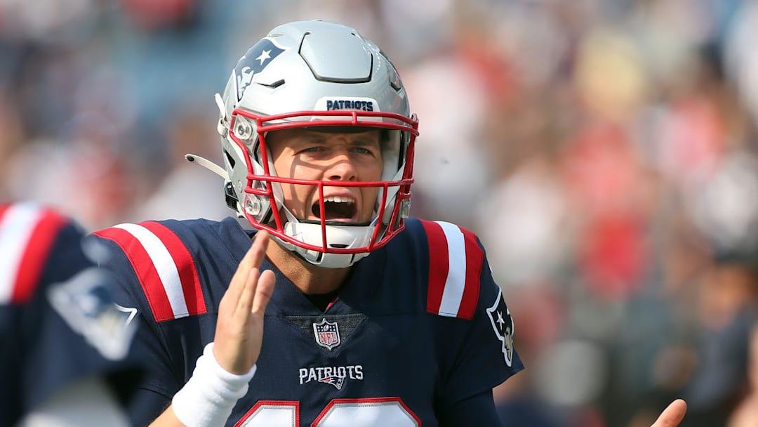 Patriots quarterback Mac Jones gets excited during pregame warmups before his first NFL start.

PATS 1