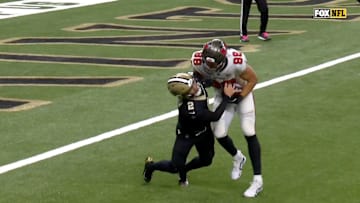 Saints quarterback Spencer Rattler got trucked after throwing an interception to Buccaneers linebacker Anthony Nelson.