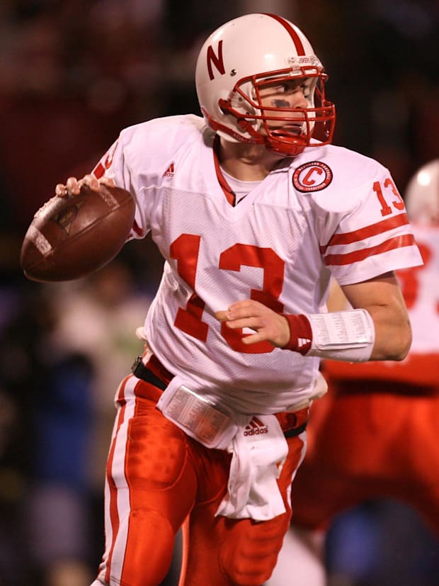 Nebraska Cornhuskers (13) Zac Taylor rolls out of his own end zone during the game against the Oklahoma Sooners.
