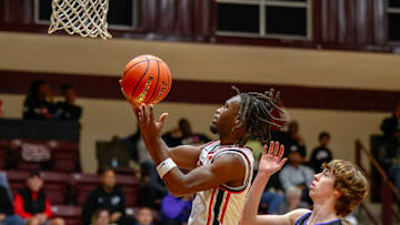 Kountze guard Zac Sells goes up for a layup in a game against Lipan in the Tenaha ISD Holiday Hoops event on Dec. 28. 