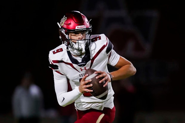 Oscar Rios of Downey High scrambles against Red Mountain (AZ).