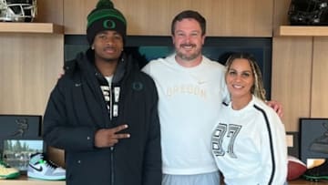 Oregon Ducks coach Dan Lanning with Messiah Hampton and his mom