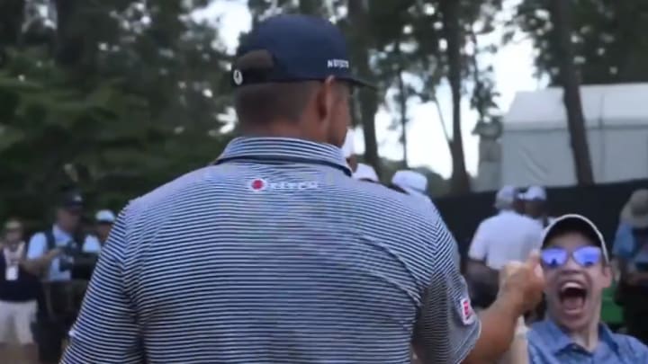 Bryson DeChambeau stopped a signed a fan's hat during the final round of the U.S. Open. 