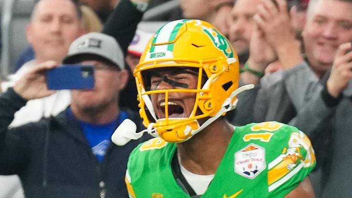 Jan 1, 2024; Glendale, AZ, USA; Oregon Ducks tight end Kenyon Sadiq (18) reacts after scoring a touchdown against the Liberty Flames in the second quarter of the 2024 Fiesta Bowl at State Farm Stadium. Mandatory Credit: Joe Camporeale-Imagn Images