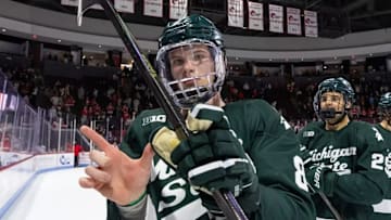 No. 3 Michigan State hockey players skate off the ice celebrating their sweep at No. 1 Boston University on Oct. 18, 2025.