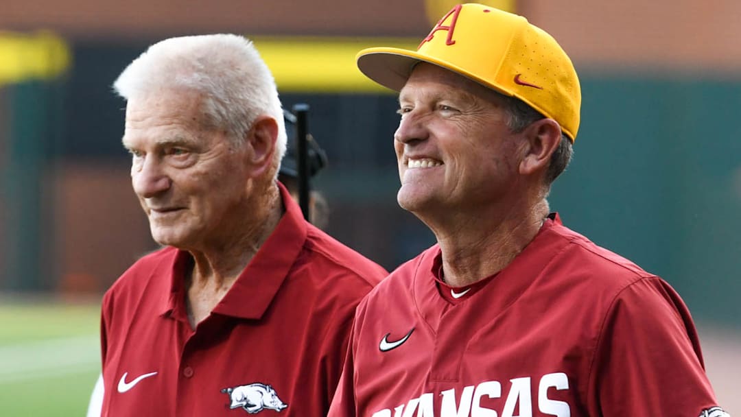 Former Arkansas Razorbacks coach Norm DeBriyn and current coach Dave Van Horn at a game against Missouri State on April 30, 2024, at Baum-Walker Stadium in Fayetteville, Ark.