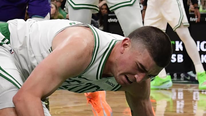 Mar 4, 2026; Boston, Massachusetts, USA; Boston Celtics guard Payton Pritchard (11) loses control of the ball while Charlotte Hornets guard Kon Knueppel (7) defends during the first half at TD Garden. Mandatory Credit: Bob DeChiara-Imagn Images