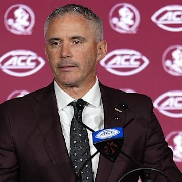 Jul 23, 2025; Charlotte, NC, USA; Florida State head coach Mike Norvell answers questions from the media during ACC Media days at Hilton Charlotte Uptown. Mandatory Credit: Jim Dedmon-Imagn Images