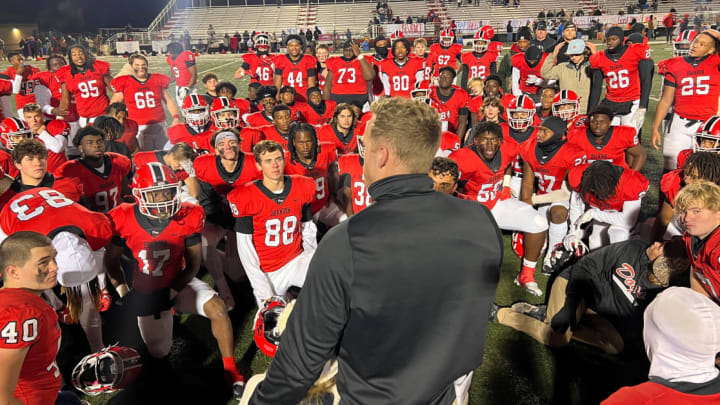 Brandon coach Sam Williams speaks to his team following the Bulldogs' win over Meridian on Oct. 27, 2023 in Brandon, Miss.