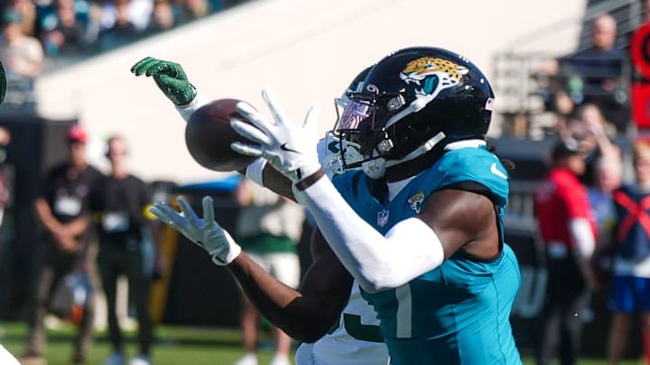 Jacksonville Jaguars wide receiver Brian Thomas Jr. (7) hauls in a pass for a touchdown in the first quarter during an NFL football game at EverBank Stadium, Sunday, Dec. 14, 2025, in Jacksonville, Fla.