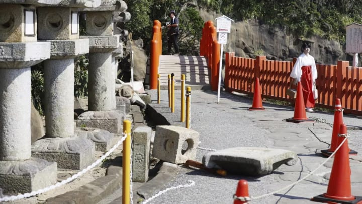 Stone lanterns that had fallen at a shrine after a strong earthquake last week in Nichinan, Japan.