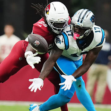 Arizona Cardinals cornerback Denzel Burke (29) makes a defensive stop against Carolina Panthers receiver Xavier Legette (17) at State Farm Stadium on Sept 14, 2025.