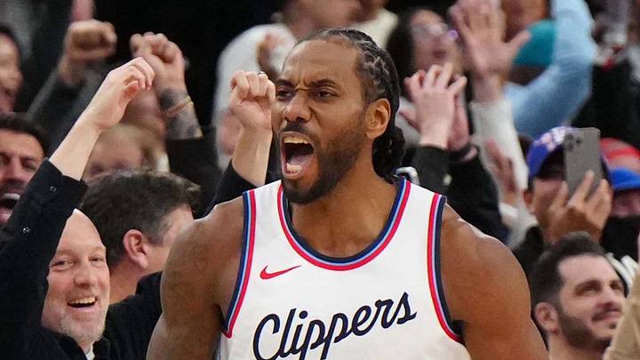 Mar 9, 2025; Inglewood, California, USA; LA Clippers forward Kawhi Leonard (2) celebrates with guard Bogdan Bogdanovic (10) after making the game-winning shot in overtime as Sacramento Kings coach Doug Christie watches at the Intuit Dome. Mandatory Credit: Kirby Lee-Imagn Images