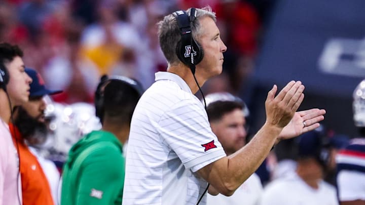 Oct 11, 2025; Tucson, Arizona, USA; Arizona Wildcats head coach Brent Brennan claps on the sidelines during the first quarter of the game against the Brigham Young Cougars at Arizona Stadium. Mandatory Credit: Aryanna Frank-Imagn Images Oct 11, 2025; Tucson, Arizona, USA; Arizona Wildcats head coach Brent Brennan claps on the sidelines during the first quarter of the game against the Brigham Young Cougars at Arizona Stadium. Mandatory Credit: Aryanna Frank-Imagn Images