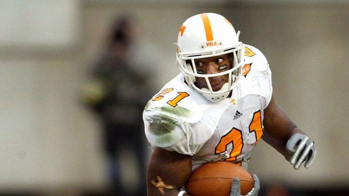 Tennessee running back Cedric Houston (21) eludes Vanderbilt defender Theo Horrocks (54) on one of his 19 carries for total of 97 yards. The 15th-ranked Vols held off Vandy 38-33 for the win at Dudley Field in Nashville on Nov. 20, 2004.