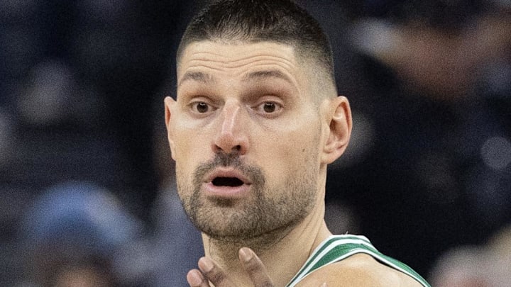 Feb 19, 2026; San Francisco, California, USA; Boston Celtics center Nikola Vucevic (4) looks to pass around Golden State Warriors guard De'Anthony Melton (8) during the first quarter at Chase Center. Mandatory Credit: D. Ross Cameron-Imagn Images