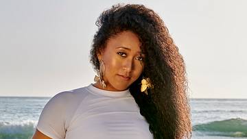 Naomi Osaka was photographed by Yu Tsai in Malibu, Calif. Swimsuit by MIKOH. Top by Love Label. Earrings by Beads Byaree.