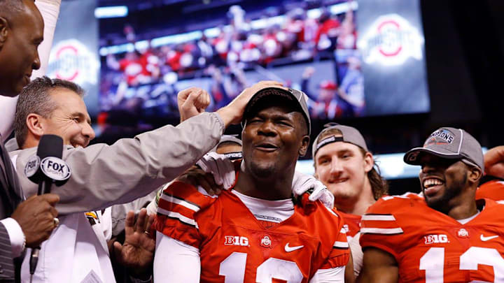 Coach Urban Meyer gives quarterback Cardale Jones a pat on the head after Ohio State crushed Wisconsin 59-0 in last season   s Big Ten championship game.Adam CairnsDispatch

Img Xtra Osu14b10 Ac 34 2 1 Q5139gsj