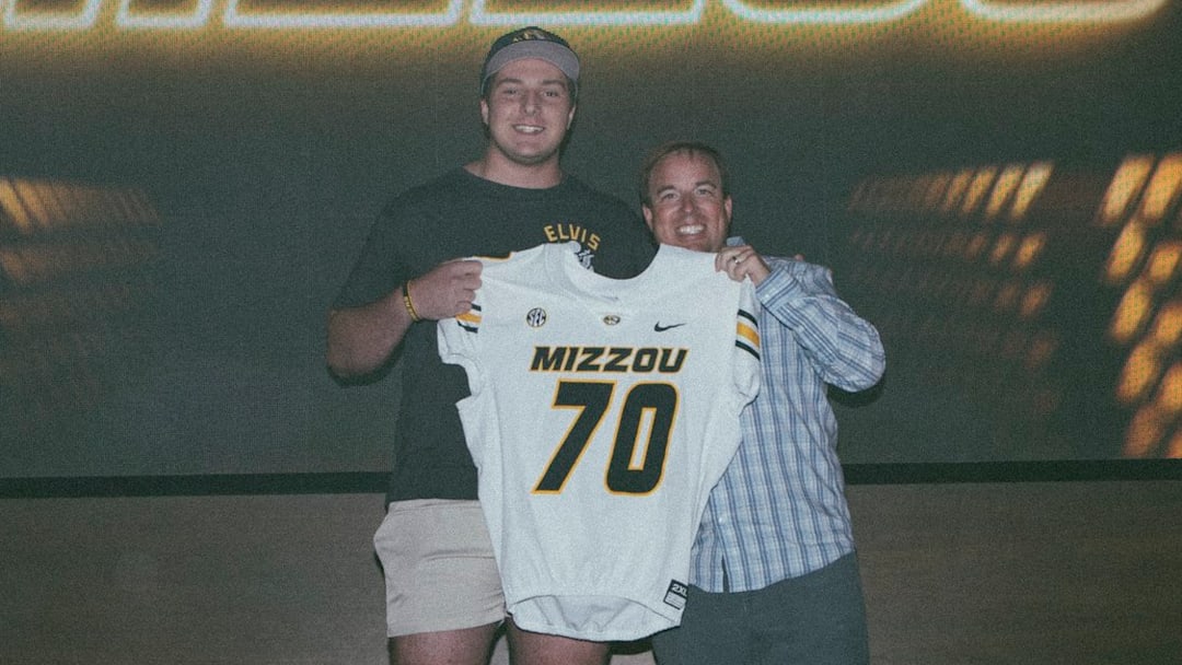 4-star Missouri football recruit Evan Goodwin stands in a photo with Missouri football head coach Eliah Drinkwitz on his official visit. 