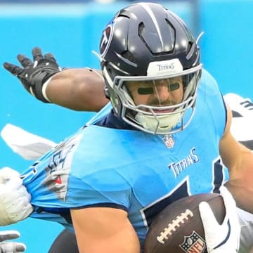 Tennessee Titans tight end Josh Whyle (81) runs the ball after a catch against Jacksonville in 2024.