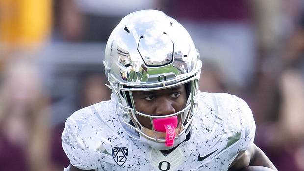 Oregon Ducks Tampa Bay Buccaneers Bucky Irving Injury Baker Mayfield College Football NFC South Big Ten NFL Draft Cardinals 
