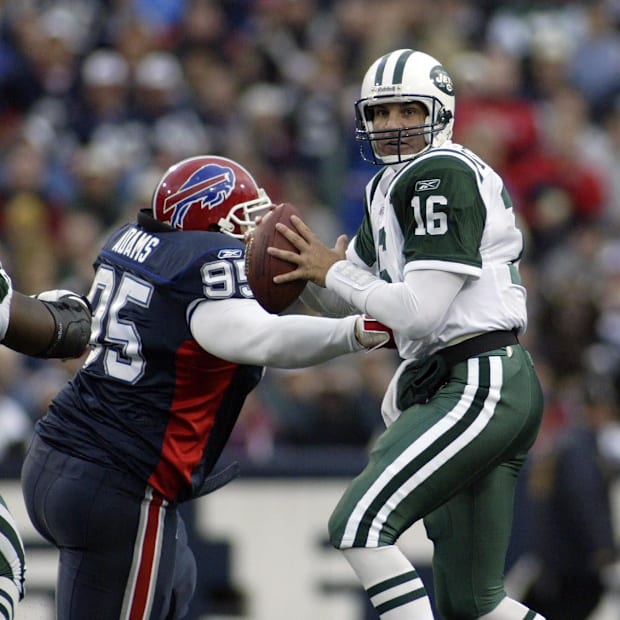 Former Buffalo Bills defensive tackle Sam Adams puts pressure on New York Jets quarterback Vinny Testaverde.