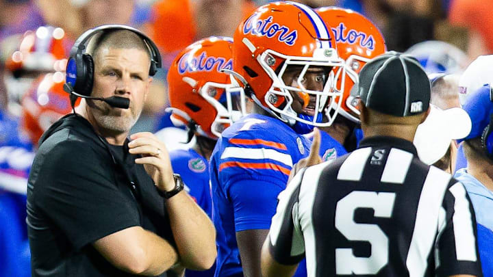 Florida Gators head coach Billy Napier talks with a sidelines official during the first half at Ben Hill Griffin Stadium in Gainesville, FL on Saturday, September 7, 2024 against the Samford Bulldogs. The Gators lead 14-0 at the half. [Doug Engle/Gainesville Sun]