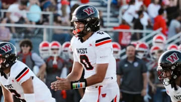 West (Salt Lake City, Utah) High School quarterback Kamden Lopati (0) prepares to take a snap in a game during the Panthers' 2024 season. Lopati on Wednesday accepted a scholarship offer to play football at the University of Illinois.