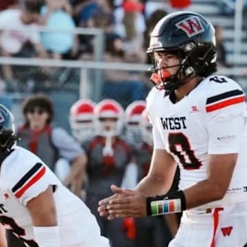 West (Salt Lake City, Utah) High School quarterback Kamden Lopati (0) prepares to take a snap in a game during the Panthers' 2024 season. Lopati on Wednesday accepted a scholarship offer to play football at the University of Illinois.