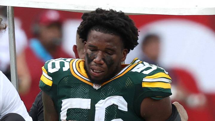 Green Bay Packers linebacker Edgerrin Cooper (56) is carted off the field