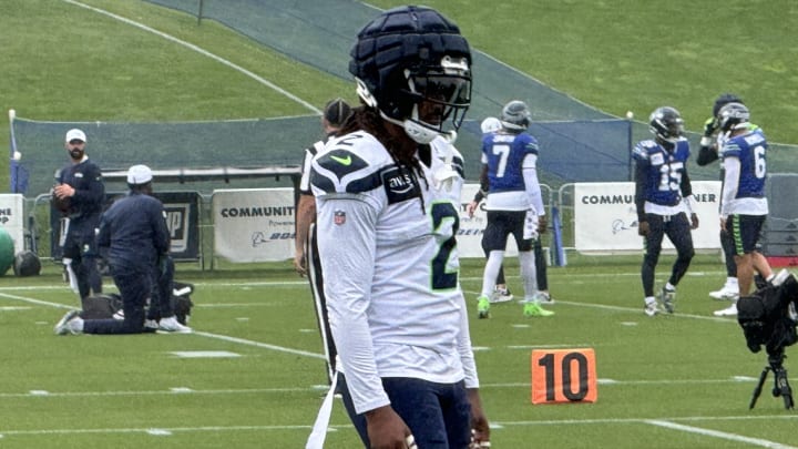 Seattle Seahawks safety Rayshawn Jenkins listens to instruction from coaches prior to a drill at training camp.