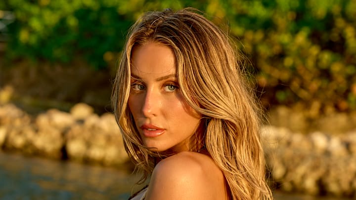 Alix Earle was photographed by Yu Tsai in Jamaica. Swimsuit by Lybethras. Body Chain by Jacquie Aiche.