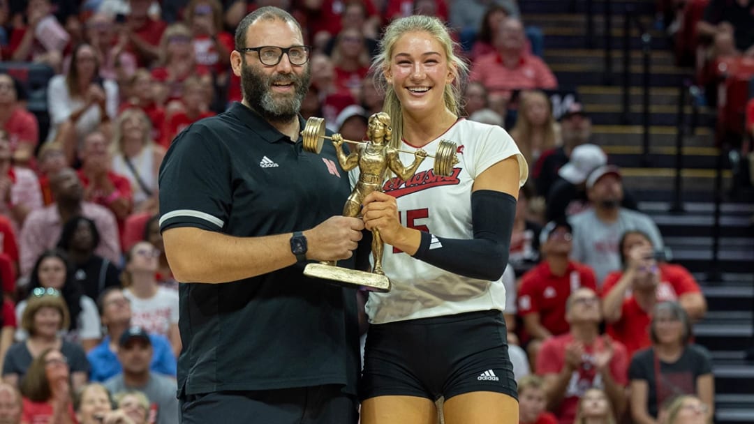 Nebraska volleyball middle blocker Andi Jackson is presented with the Lifter of the Year trophy between sets at the Red-White Scrimmage.