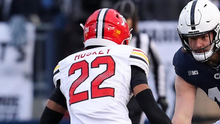 Nov 30, 2024; University Park, Pennsylvania, USA; Penn State Nittany Lions tight end Tyler Warren (44) runs with the ball against Maryland Terrapins defensive back Jalen Huskey (22) during the first quarter at Beaver Stadium. Mandatory Credit: Matthew O'Haren-Imagn Images