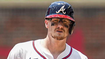 Atlanta Braves catcher Sean Murphy (12) arrives at second base in front of Baltimore Orioles first baseman Coby Mayo (16) after hitting a double during the seventh inning at Truist Park.