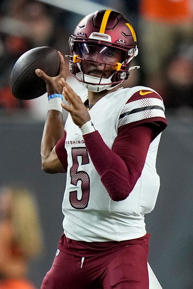 Washington Commanders quarterback Jayden Daniels throws a pass in the second quarter