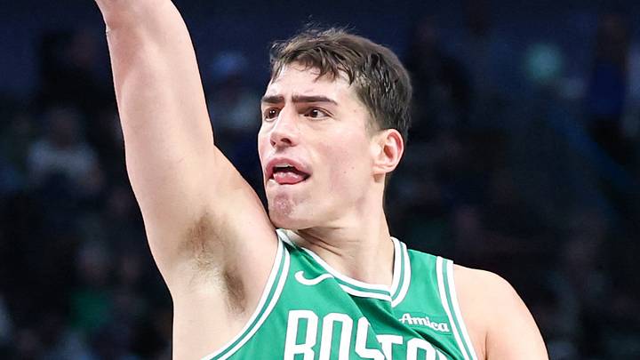 Feb 3, 2026; Dallas, Texas, USA;  Boston Celtics center Luka Garza (52) shoots over Dallas Mavericks guard Klay Thompson (31) during the second half at American Airlines Center. Mandatory Credit: Kevin Jairaj-Imagn Images