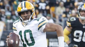 Green Bay Packers quarterback Jordan Love (10) scrambles with the ball against the Pittsburgh Steelers in 2023.