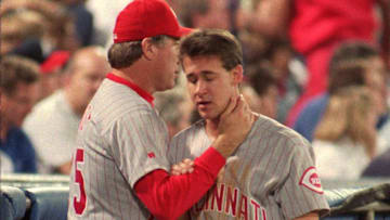 Oct. 13, 1995: Reds' third base coach Ray Knight tries to pump-up a depressed Bret Boone during the fifth inning of play. Knight held Boone at third base on a would-be inside the park homer.

Title