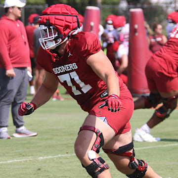 Oklahoma Sooners offensive lineman Logan Howland runs a drill during practice on August 5, 2024.