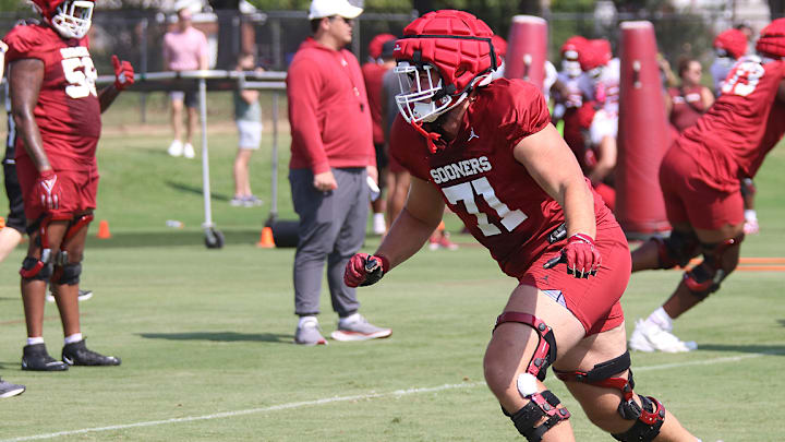 Oklahoma Sooners offensive lineman Logan Howland runs a drill during practice on August 5, 2024.