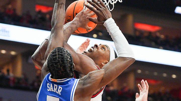 Louisville Cardinals guard Ryan Conwell (3) gets pressure from Duke Blue Devils guard Dame Sarr (7) in the second half as the Cards fall to Duke 84-73 Tuesday night at KFC Yum Center.