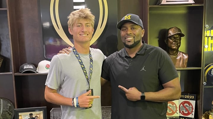 Four-star 2026 Cocoa (Fla.) quarterback Brady Hart poses with Michigan head football coach Sherrone Moore on a recruiting visit to Ann Arbor