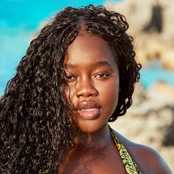 Achieng Agutu was photographed by Ben Watts in Bermuda. Swimsuit by Camila Coelho.