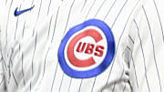Jul 6, 2025; Chicago, Illinois, USA;  Chicago Cubs outfielder Kyle Tucker (30) high fives Chicago Cubs first base coach Jose Javier (65) after he hits a two RBI single against the St. Louis Cardinals during the third inning at Wrigley Field. 