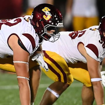 The St. Joseph football team competes against Ridgefield earlier in the season.