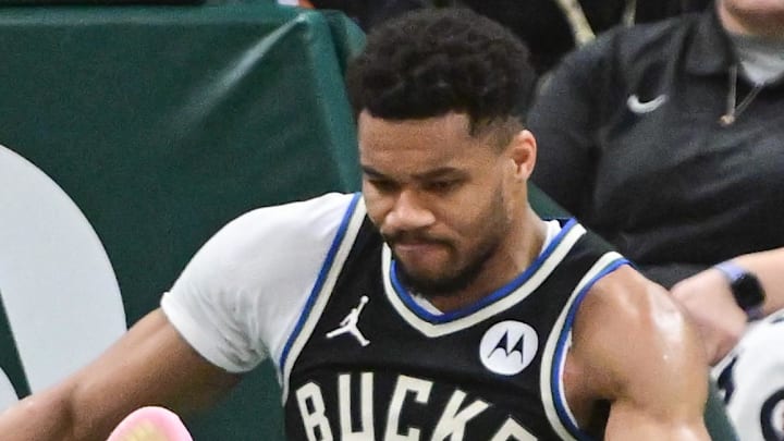Mar 15, 2026; Milwaukee, Wisconsin, USA; Milwaukee Bucks forward Giannis Antetokounmpo (34) holds his knee after dunking a basket against the Indiana Pacers in the third quarter and had to leave the game at Fiserv Forum. Mandatory Credit: Benny Sieu-Imagn Images