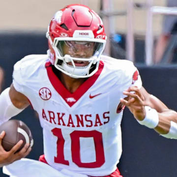 Arkansas Razorbacks quarterback Taylen Green takes off running against the Oklahoma State Cowboys.