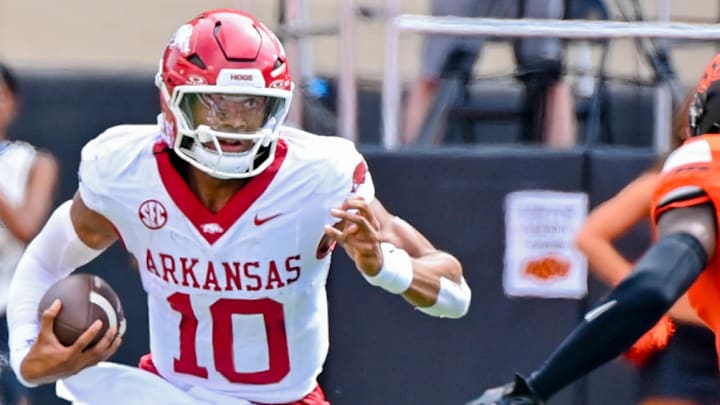 Arkansas Razorbacks quarterback Taylen Green takes off running against the Oklahoma State Cowboys.