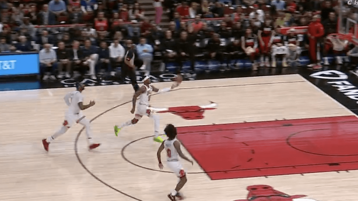 Chicago Bulls forward Torrey Craig attempts a self alley-oop as teammate Andre Drummond trails.